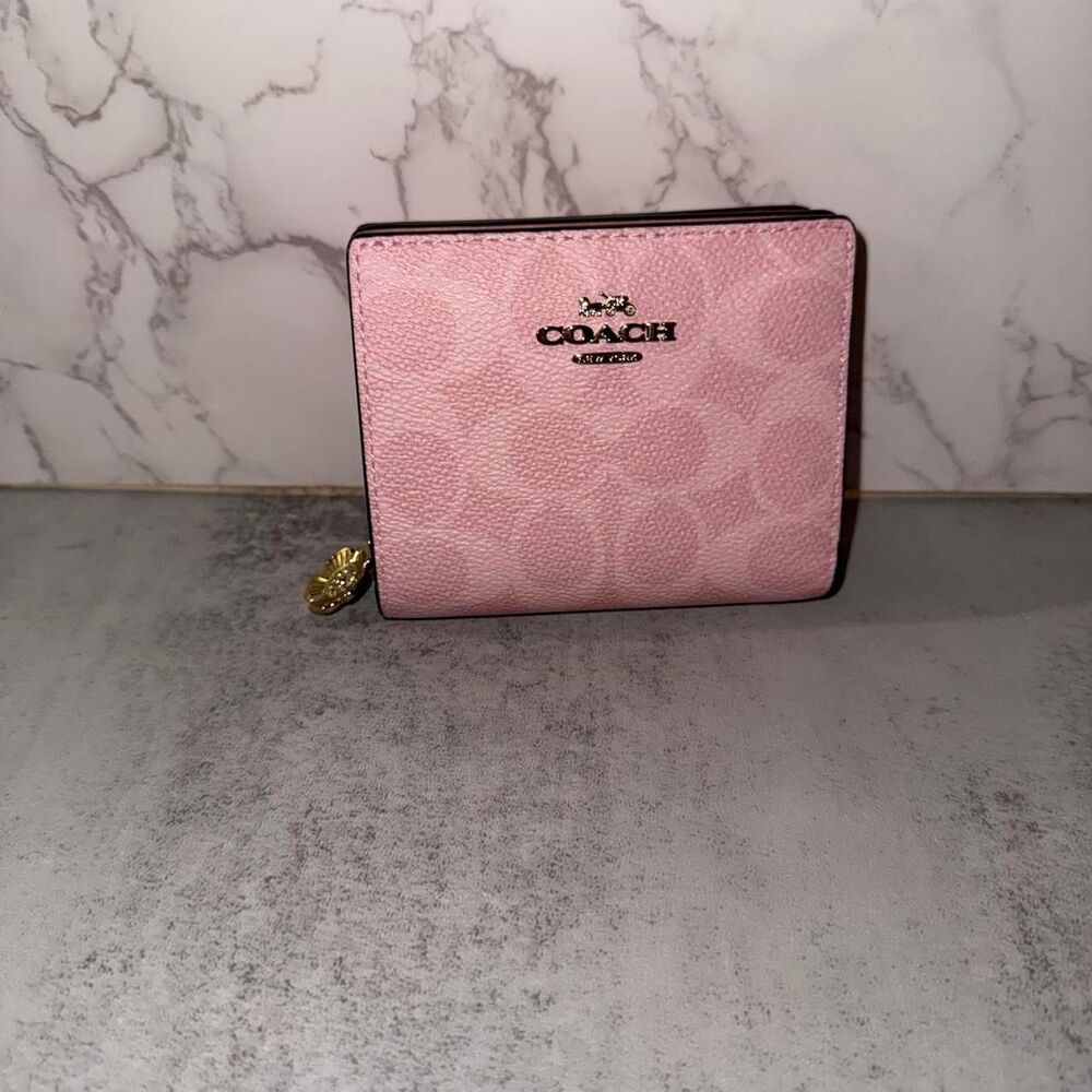 Coach powder pink snap wallet with gold charm